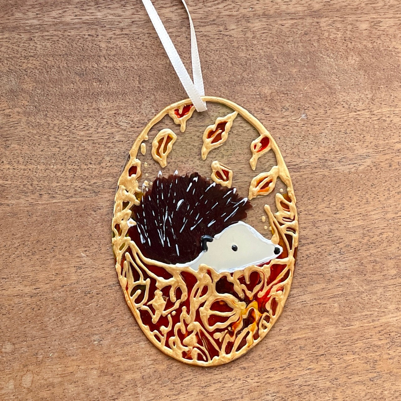 Hedgehog in autumn~ Oval suncatcher