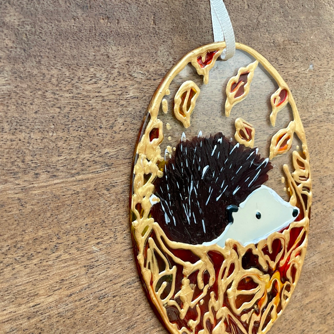 Hedgehog in autumn~ Oval suncatcher