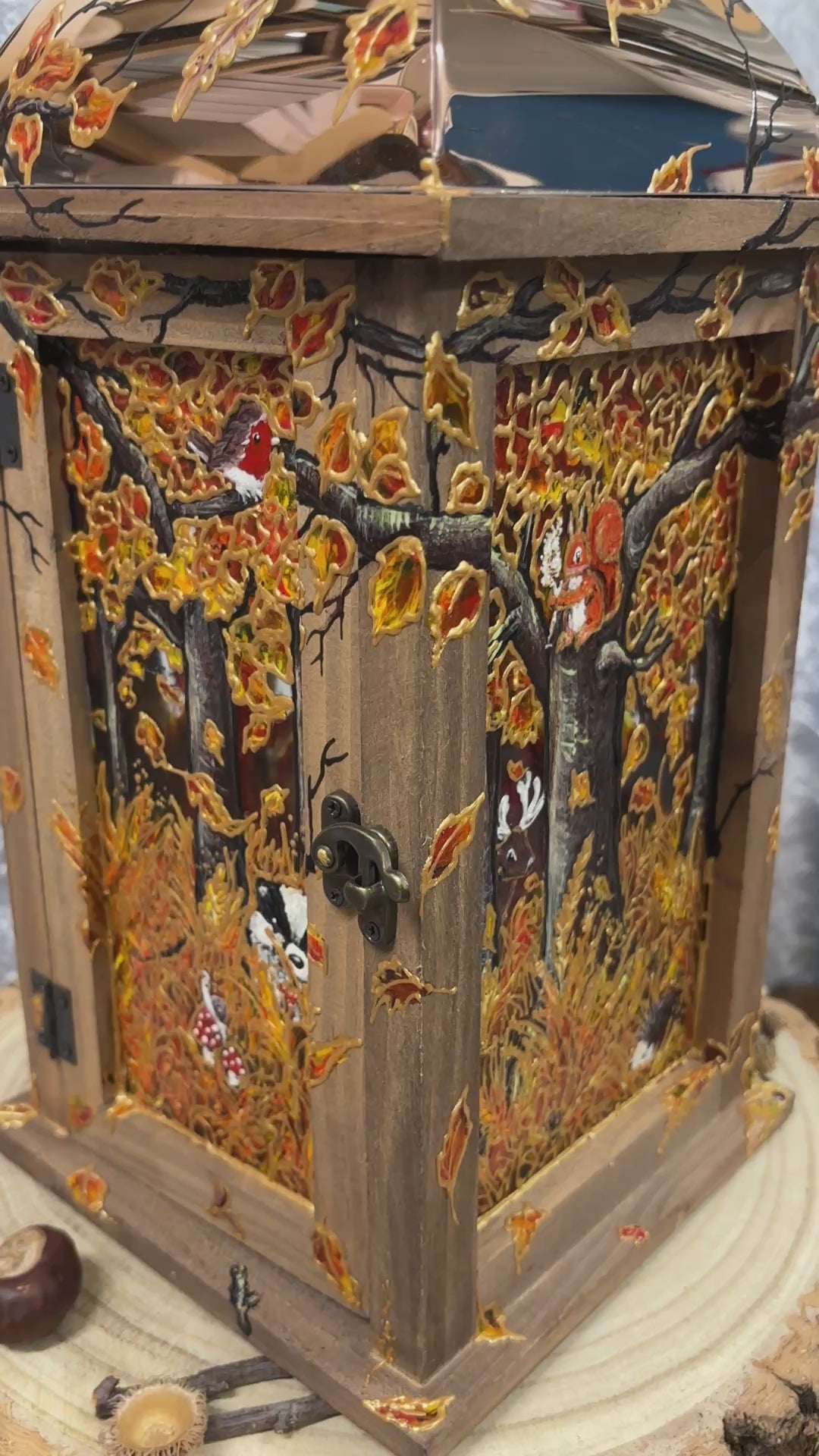 Wooden & Copper topped lantern handpainted with a autumnal woodland scene. Featuring Foxes, owl, Red squirrel, Badger, snail, Robin, Stag & hedgehog. With autumn foliage like acorns, mushrooms and fallen leaves